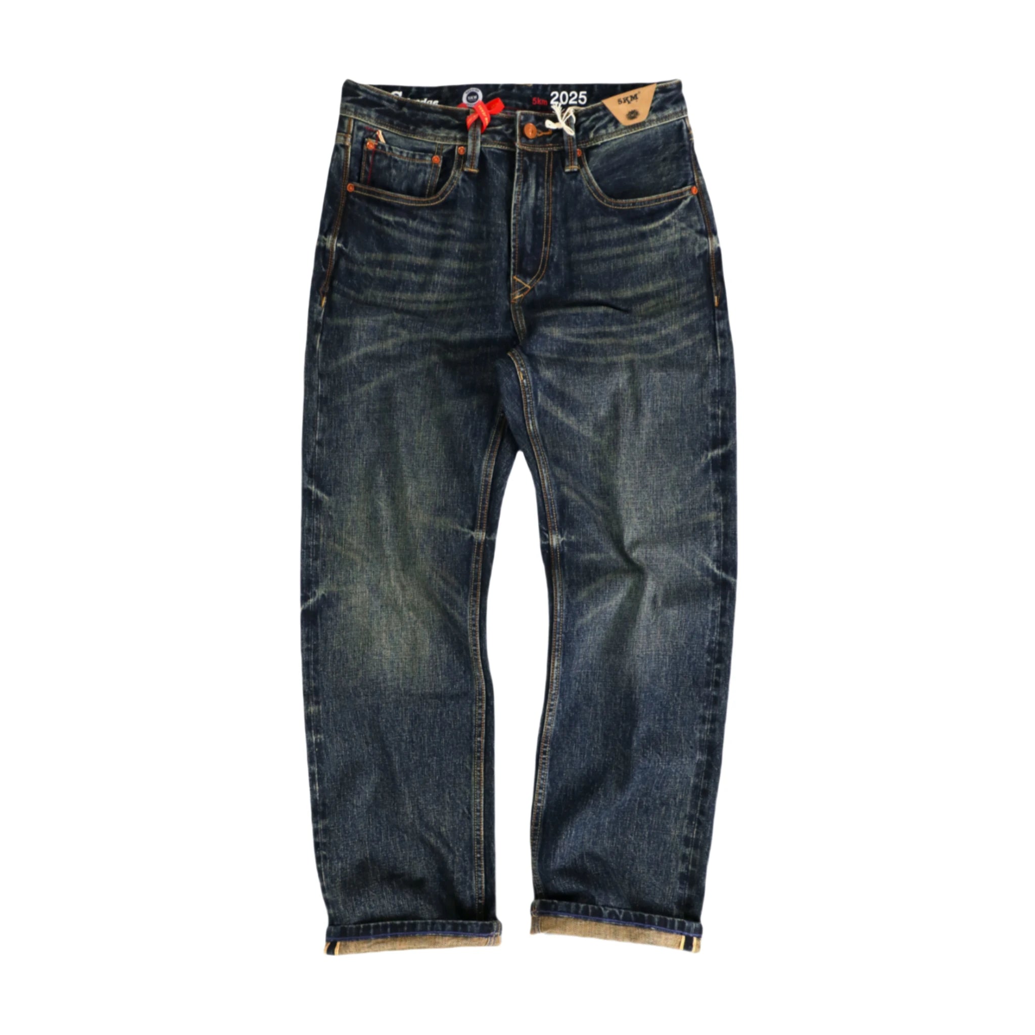 Blue jeans with visible branding on a white background