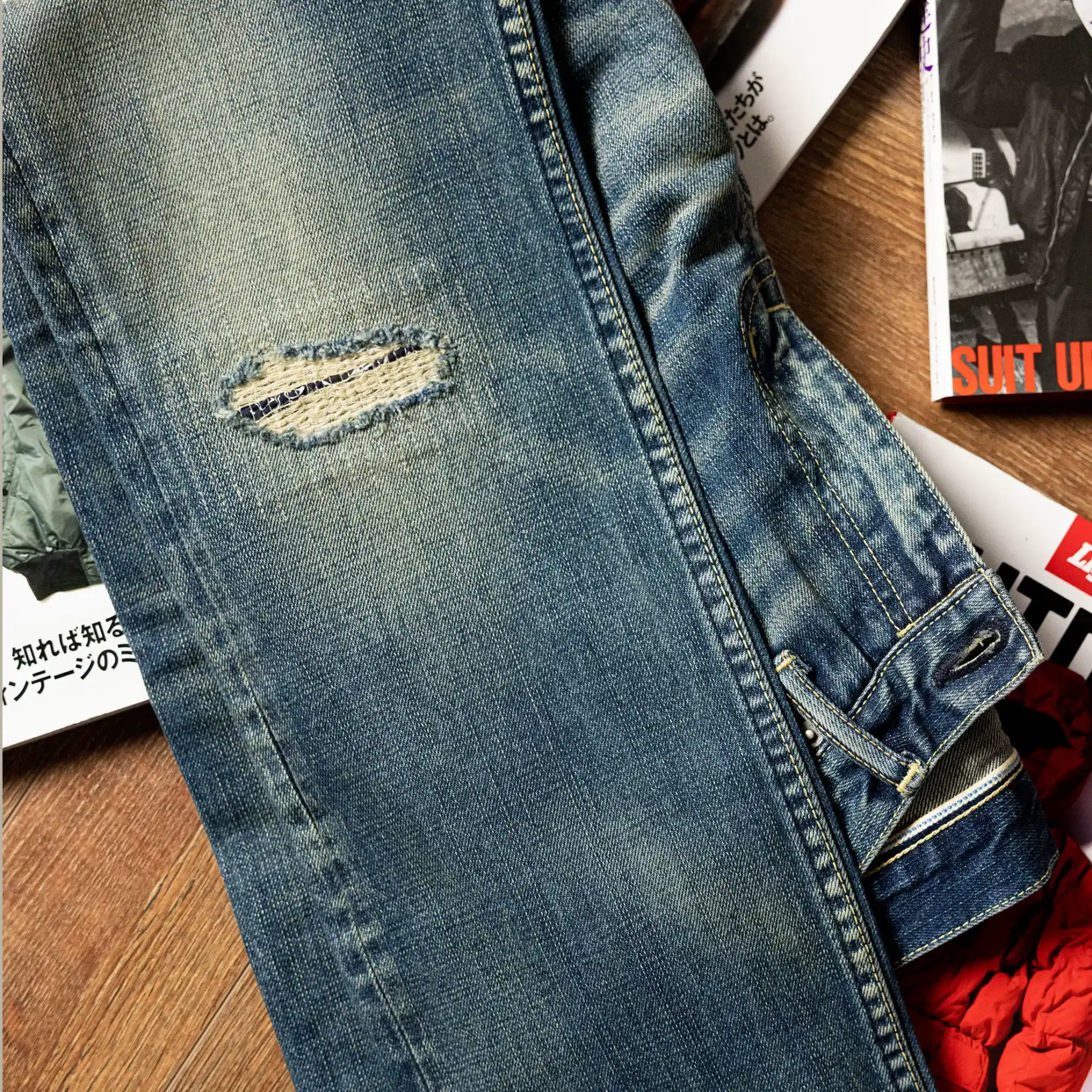 Close-up of a washed blue jeans laying on a table