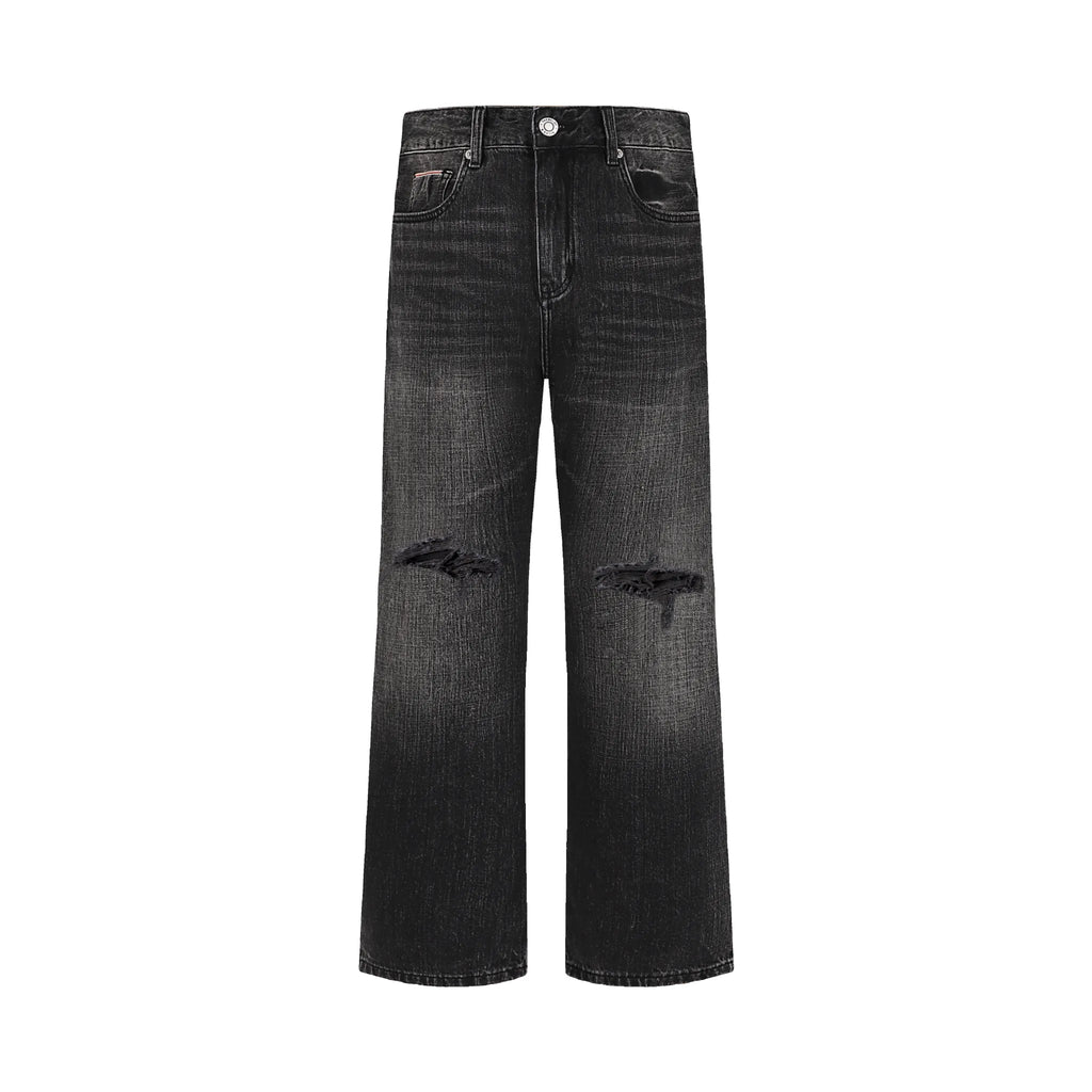 Black distressed jeans on a white background