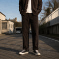 Model wearing dark brown 8-Wale Cotton Corduroy Work Pants With Button Fly