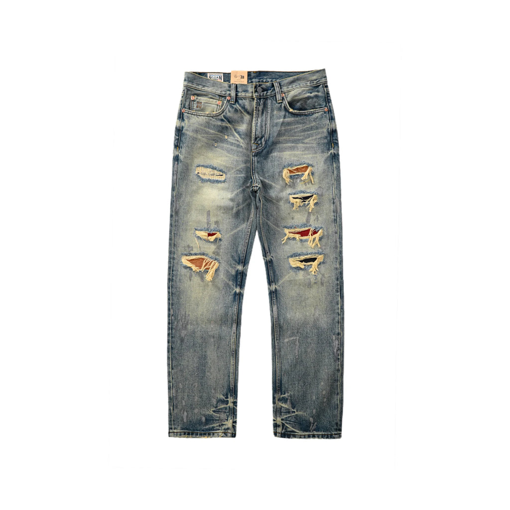 Distressed blue jeans on a white background