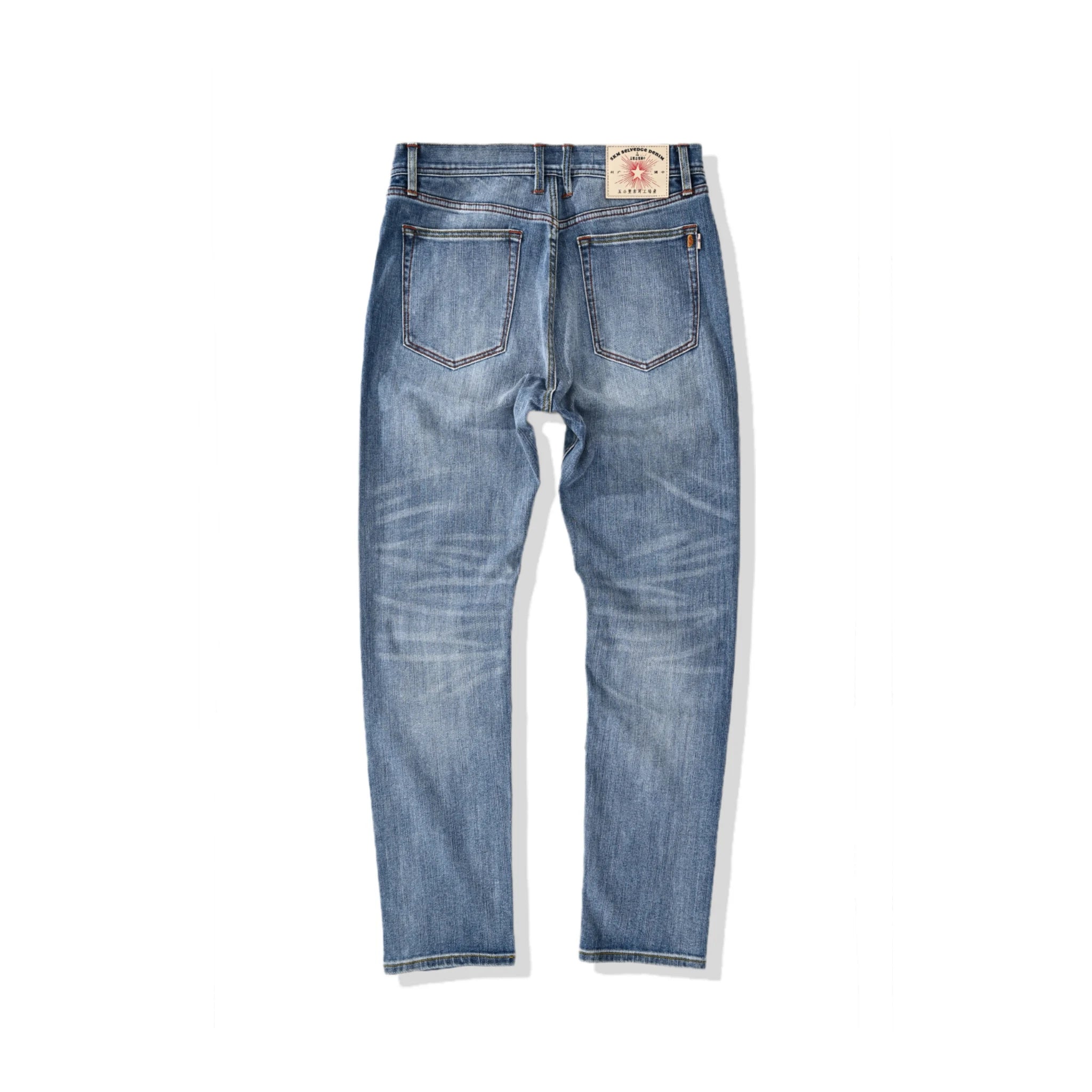 Jean selvedge bleu moyen coupe slim 12 oz avec un léger effet flammé