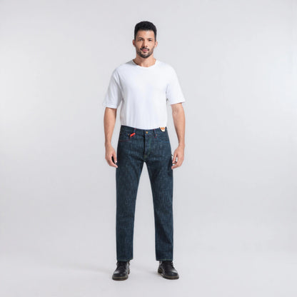 Man wearing a white t-shirt and dark blue jeans on a light gray background