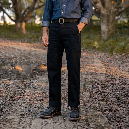 Front view of model wearing 14.5oz Double Dyed Straight Fit Black Selvedge Chinos